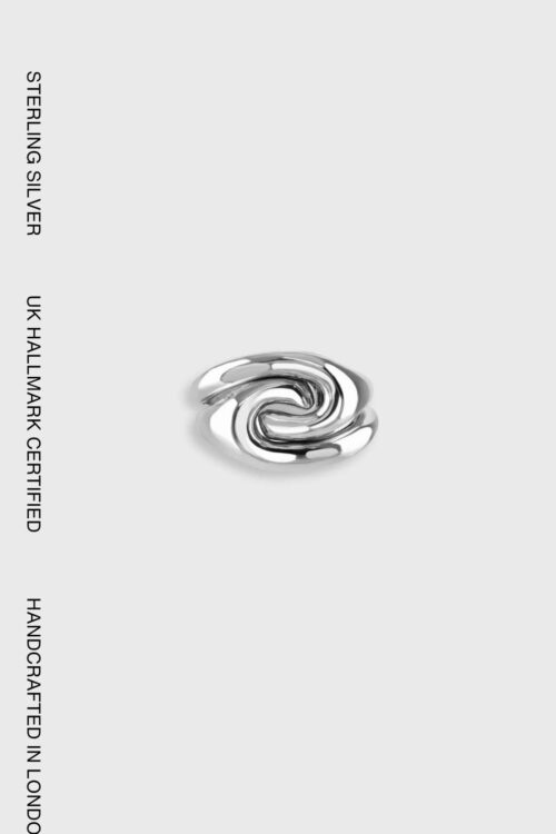 Ravel Ring in sterling silver featuring fluid, flowing sculptural curves inspired by the movement of water, handcrafted in London.