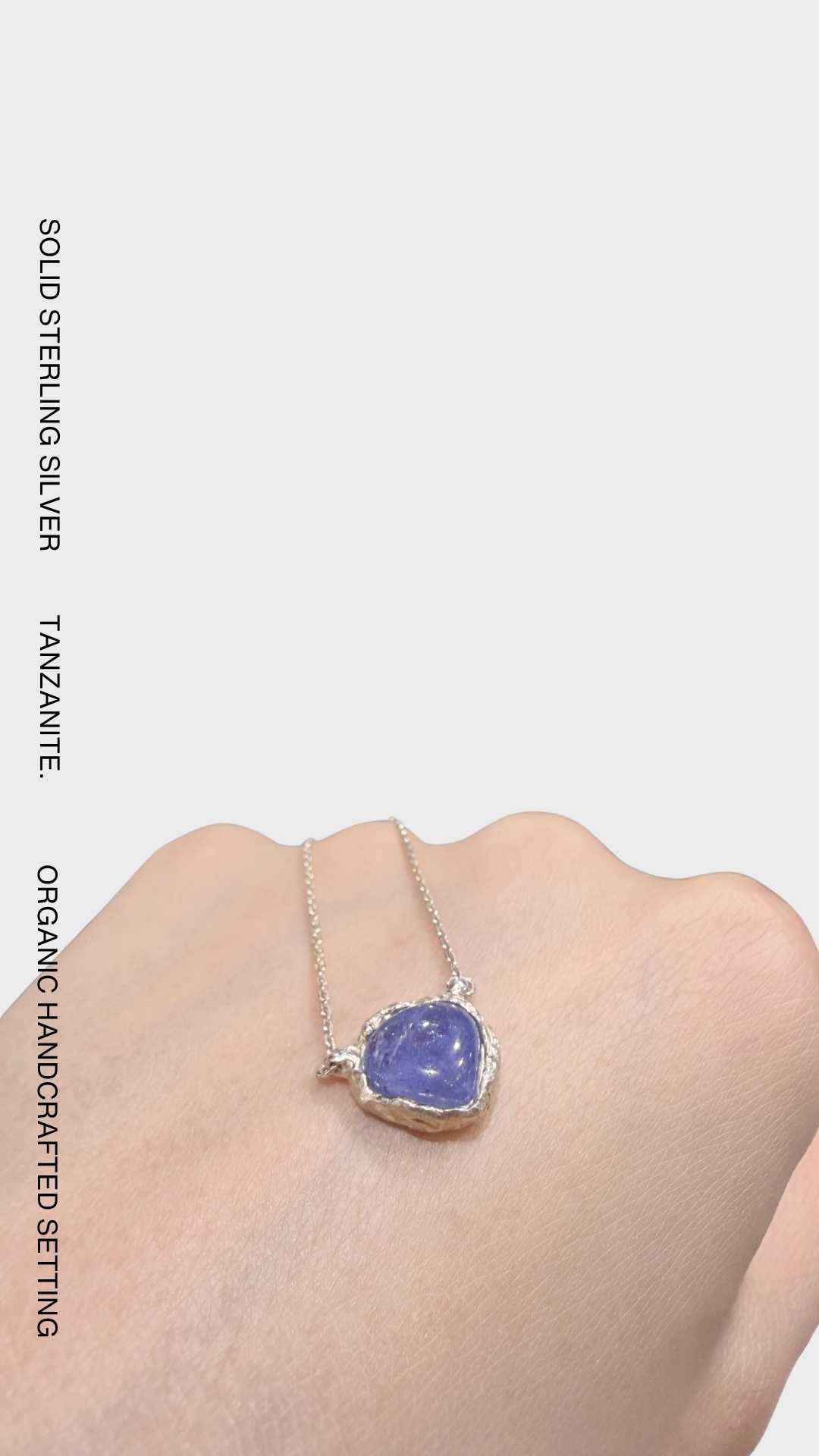 One-of-a-kind 925 sterling silver pendant necklace featuring a natural tanzanite gemstone in an organic handcrafted setting.