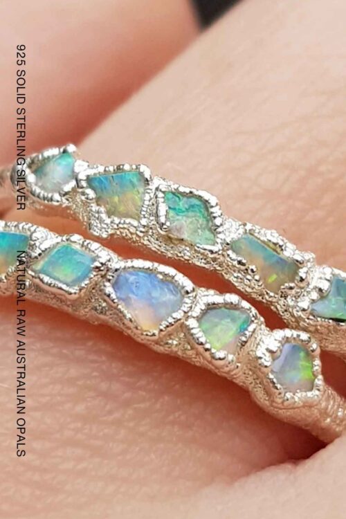 Handcrafted sterling silver ring featuring five natural raw Australian opals set in an organic textured recycled silver band by Jo Cooper.