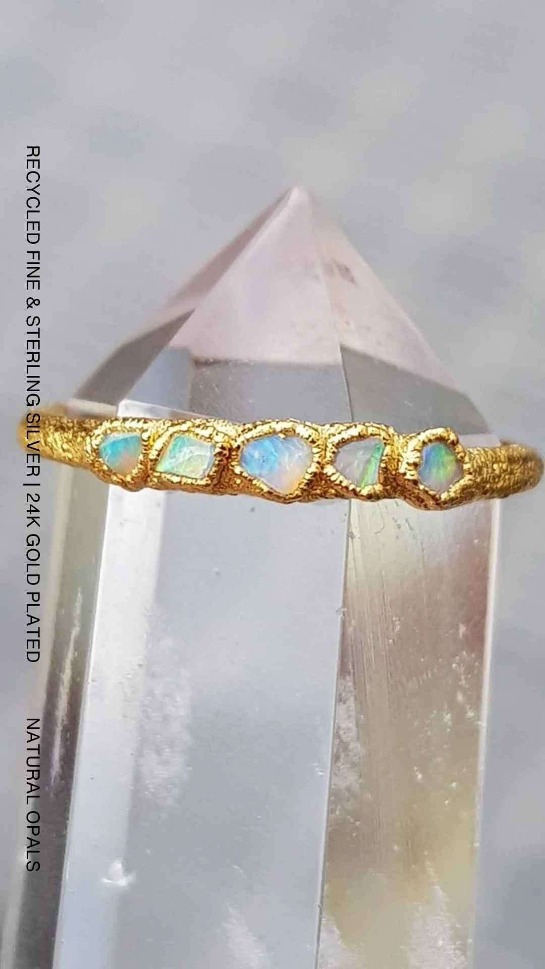 Handcrafted sterling silver ring featuring five natural raw Australian opals set in an organic textured recycled silver band by Jo Cooper.