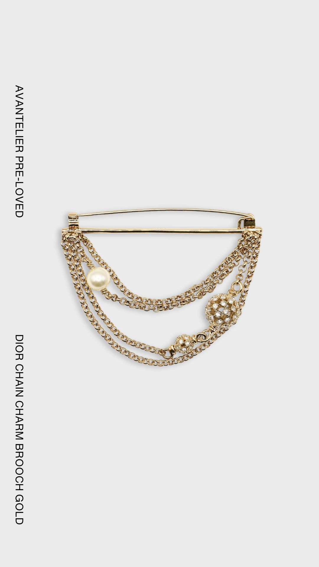 Dior gold-finish chain brooch with CD charms, crystal embellishments and white resin pearl.